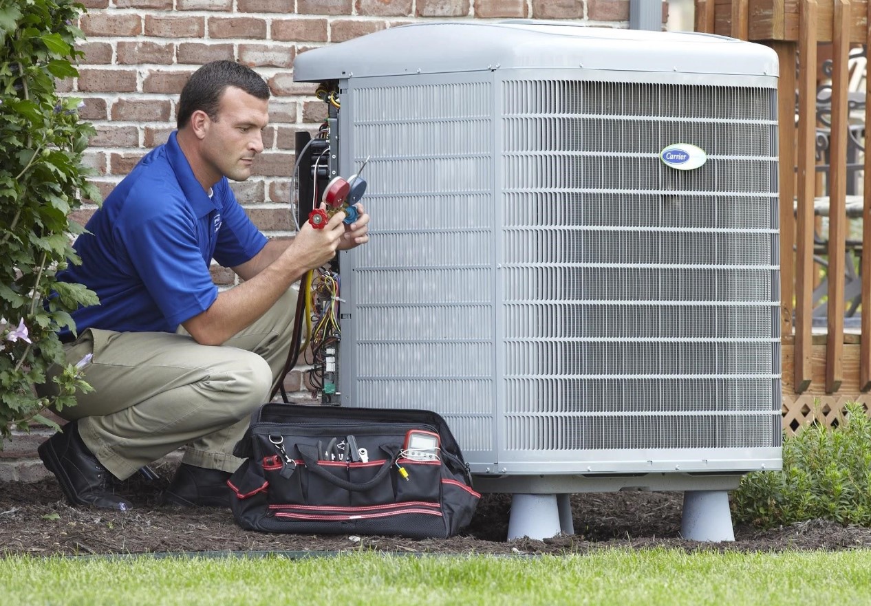 Technician-performing-heater-maintenance